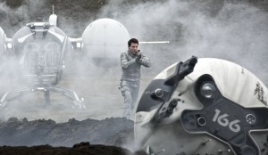 Jack Harper approaches a downed drone