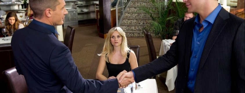 FDR and Tuck shake hands in front of Lauren