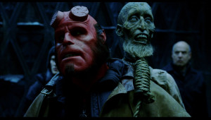 Hellboy carries a skeleton