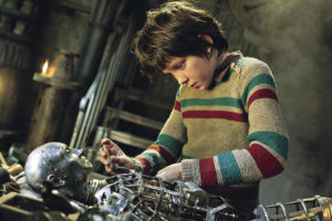 Hugo works on his mechanical man