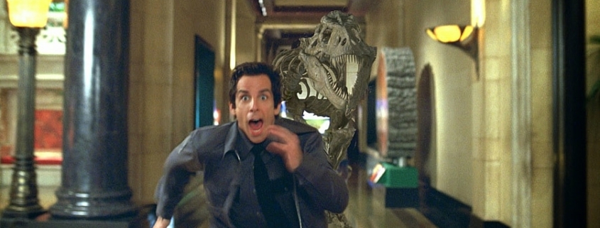 Larry runs from the T-Rex. Night at the Museum