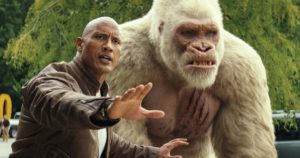 Davis Okoye protects a super sized George. Rampage the Gorilla